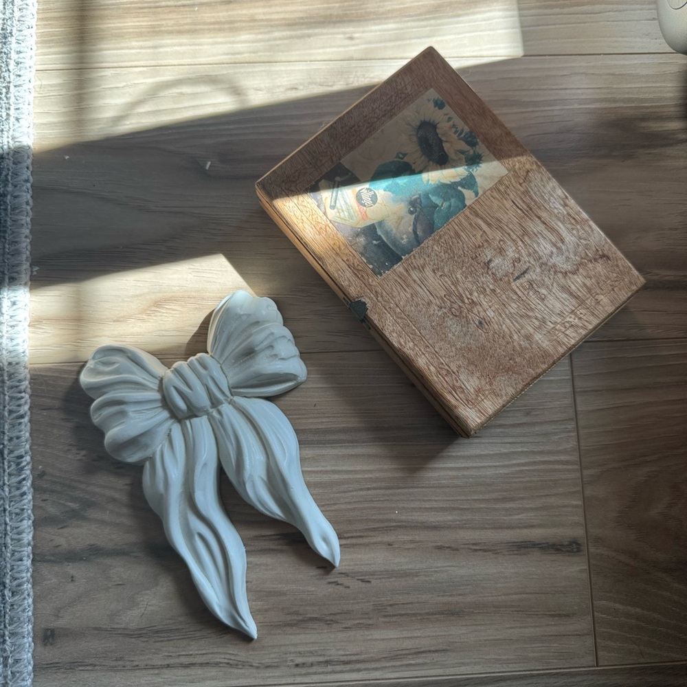 white bow decoration and small vintage cigar box bundle